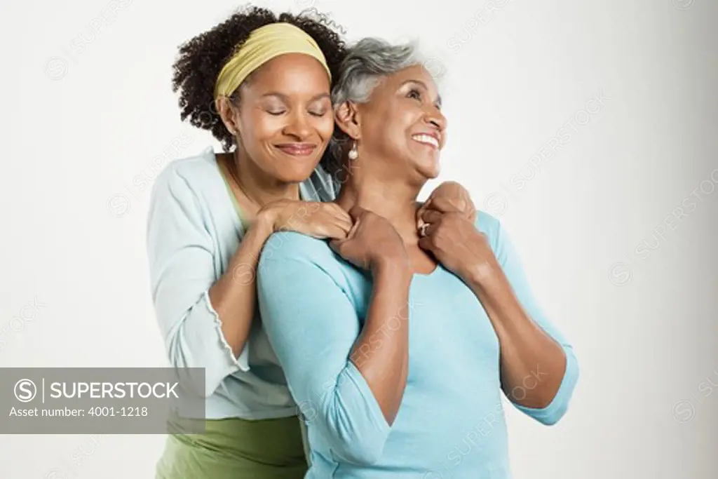 Senior woman with her daughter smiling