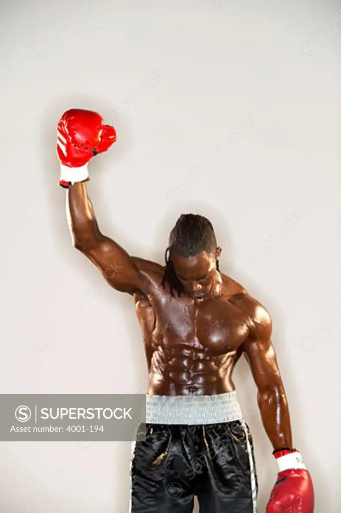 Boxer raising his hand after victory