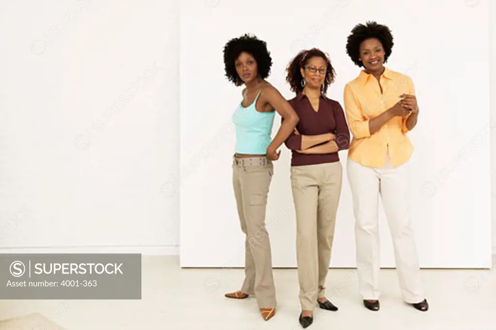 Mature woman standing with her daughters