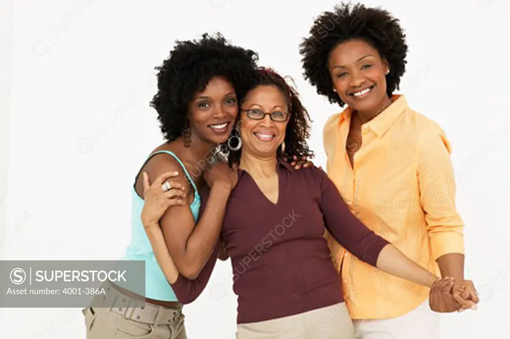 Mature woman smiling with her daughters