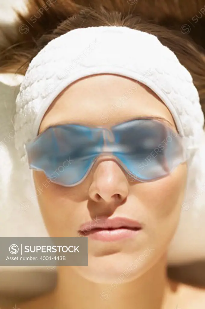 Close-up of a young woman wearing an eye mask