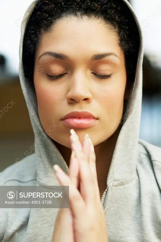 Close-up of a young woman meditating