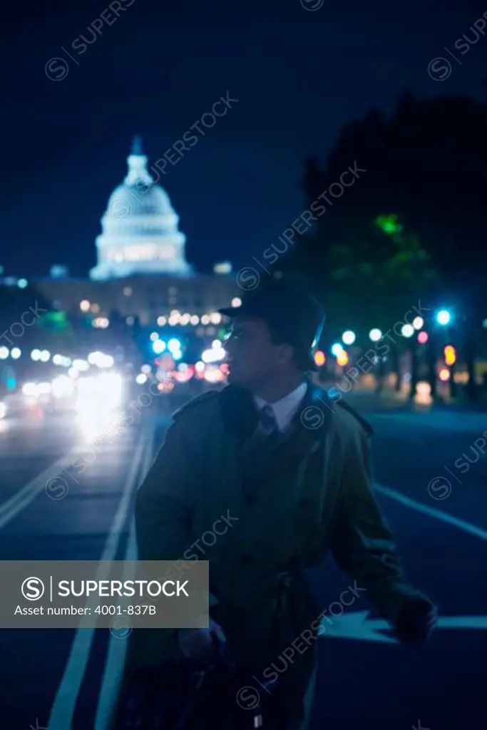 Spy running on a road with a government building in the background, Capitol Hill, Washington DC, USA