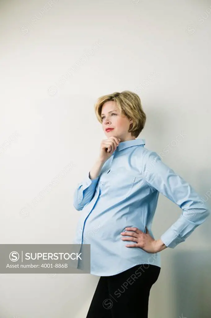 Pregnant woman contemplating whether it is a boy or a girl