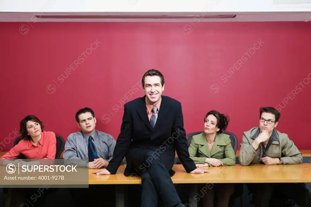Business executives sitting in a board room