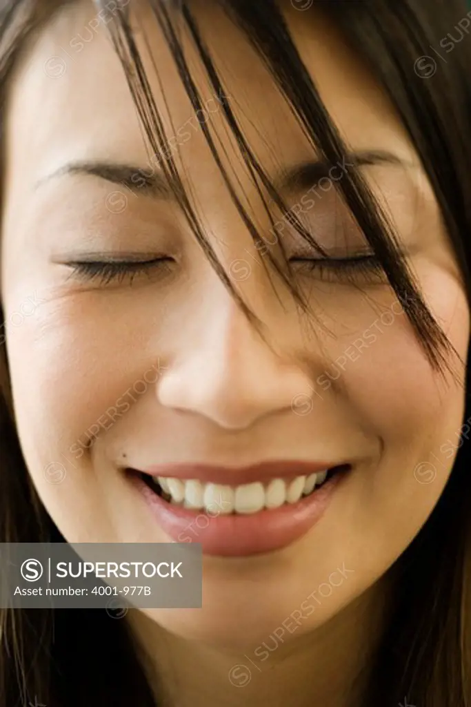Close-up of a young woman day dreaming
