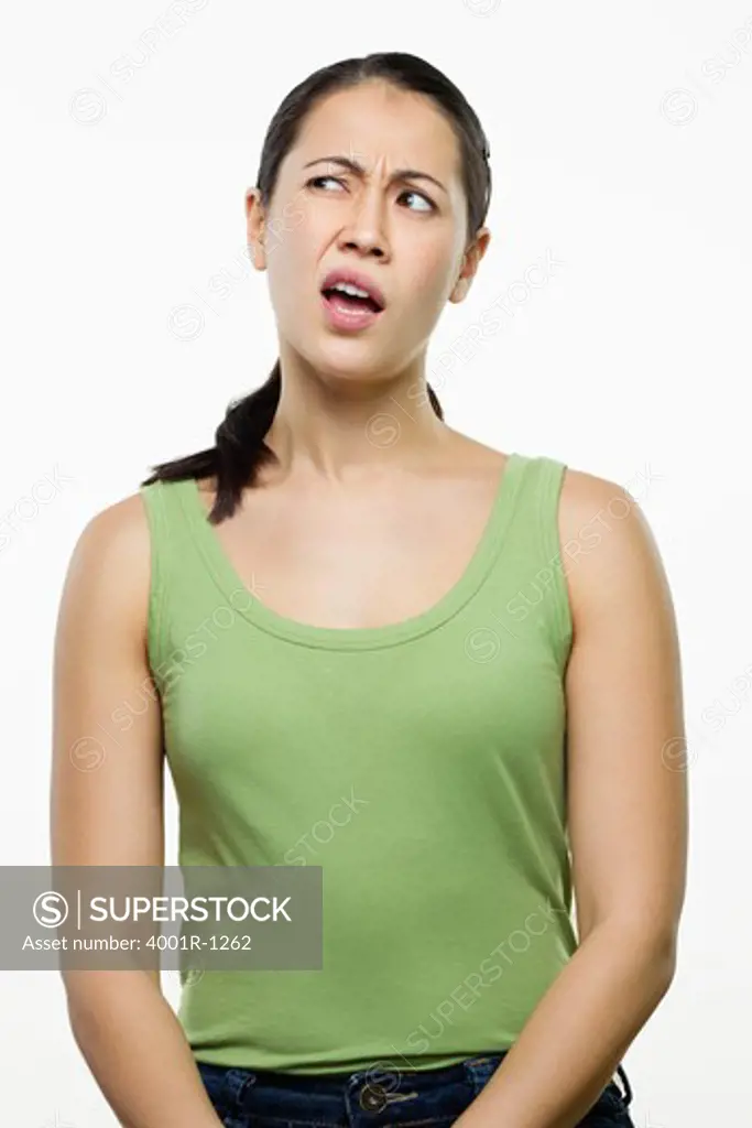 Young woman making a face and thinking