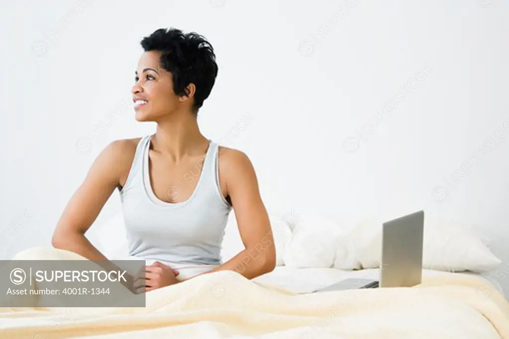 Mid adult woman sitting on the bed