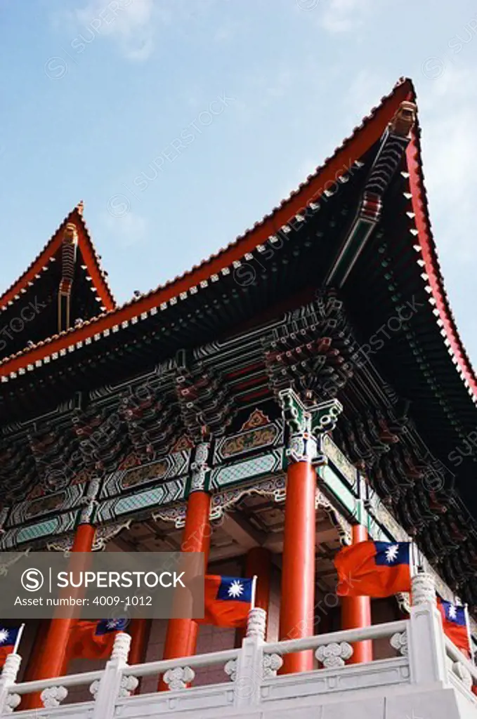 Low angle view of flags flying on the balcony of the National Theater, Taipei, Taiwan