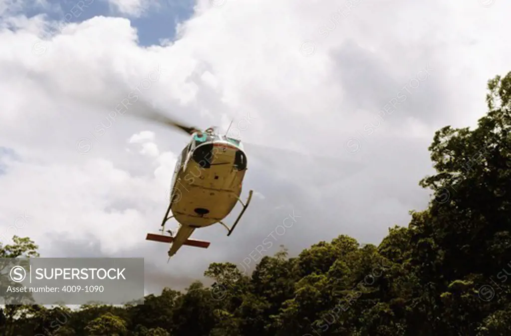 Low angle view of a helicopter, Jayawijaya Mountains, Irian Jaya, New Guinea, Indonesia