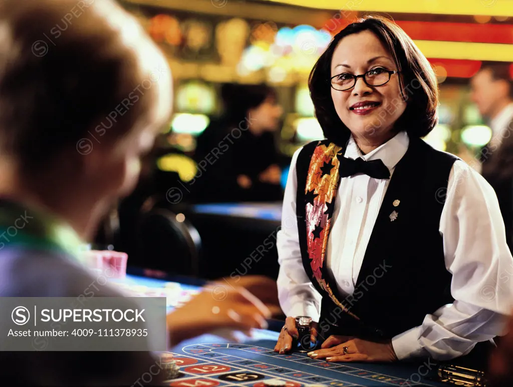 Woman dealer in casino