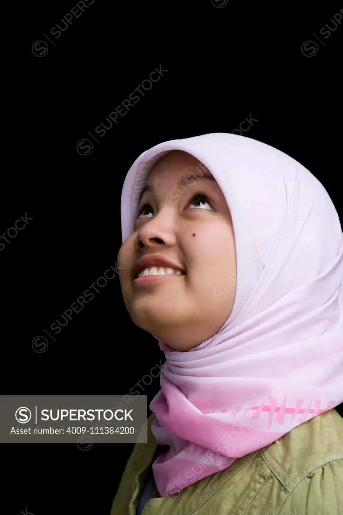 Indonesian teenager wearing headscarf smiling