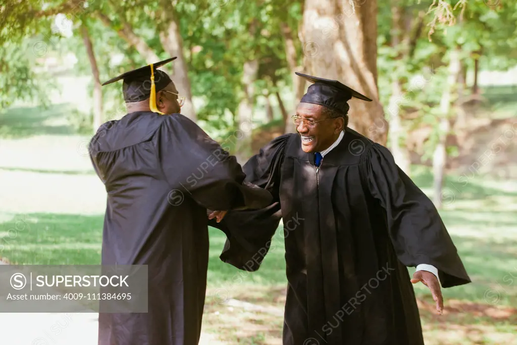 Senior African men in graduation caps and robes