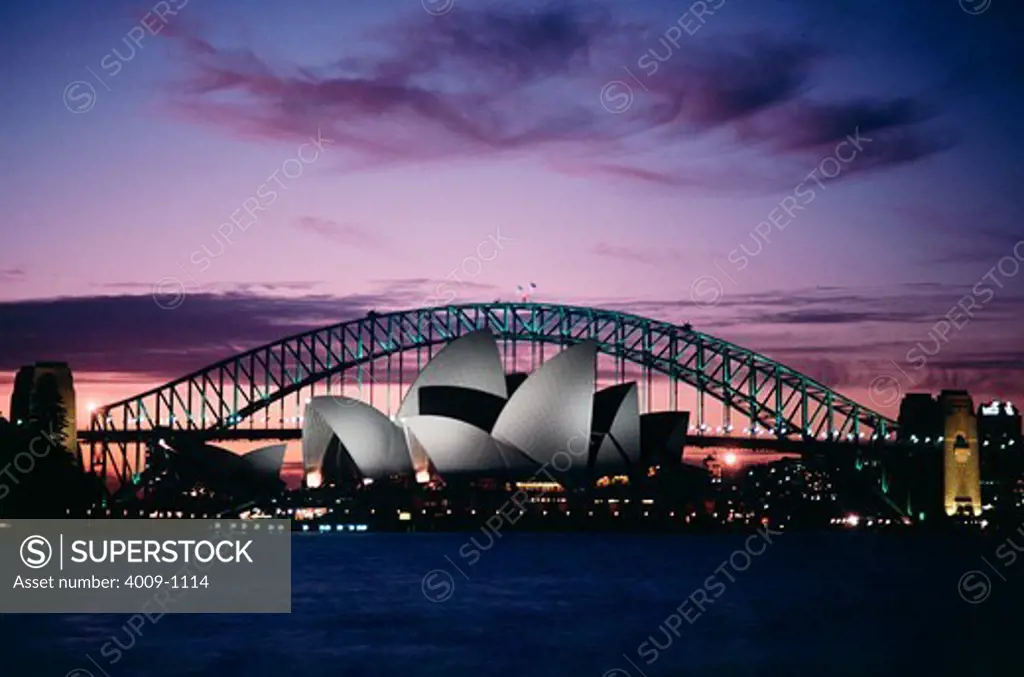 Opera house and bridge lit up at night, Sydney Opera House, Sydney Harbor Bridge, Sydney, New South Wales, Australia
