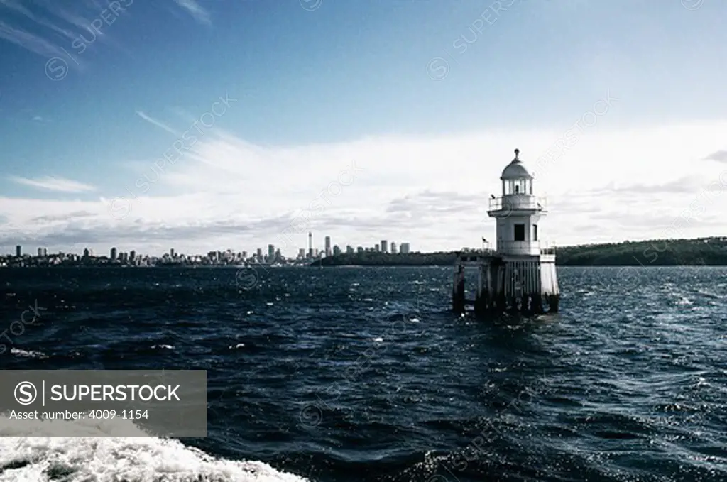 Lighthouse with buildings in the background, Sydney, New South Wales, Australia