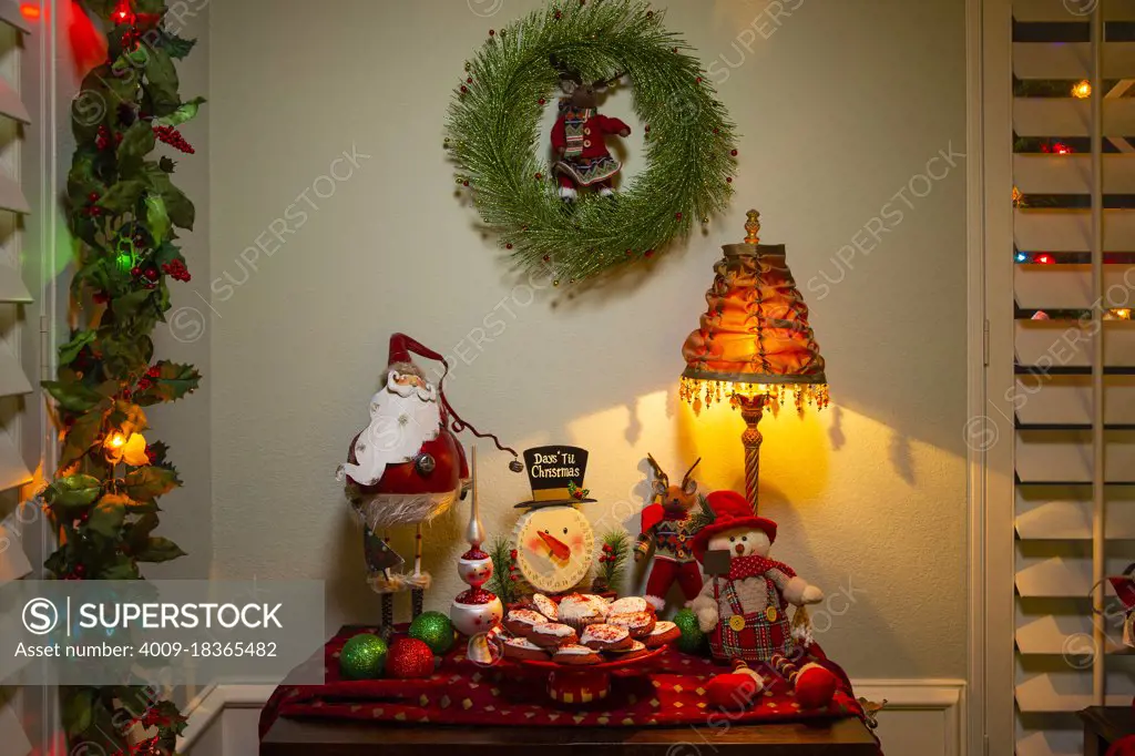 Detail of  dining room table decorated for festive Christmas party with cookies and decorations