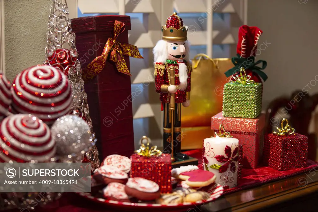 Detail of dining room table decorated for festive Christmas party with cookies and decorations