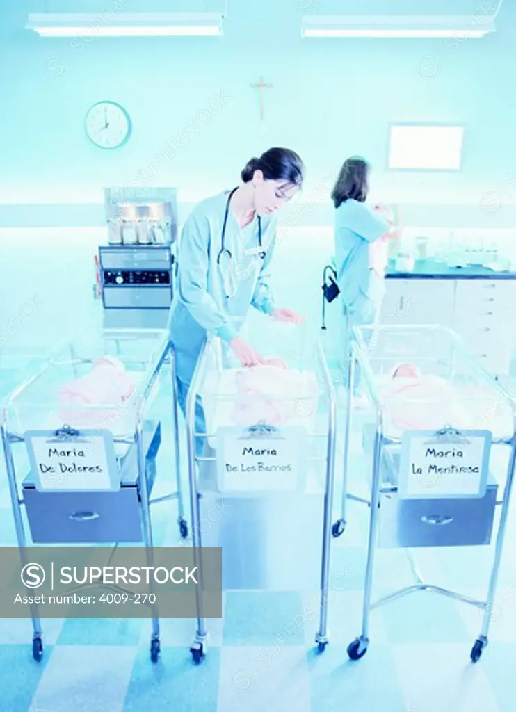 Nurses taking care of babies at the hospital maternity ward