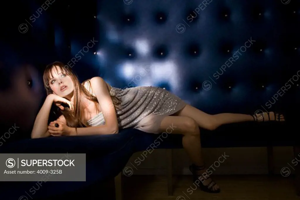 Woman posing on a couch