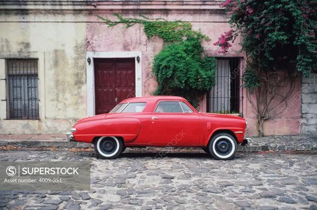 Antique car on a cobblestone road, Buenos Aires, Argentina