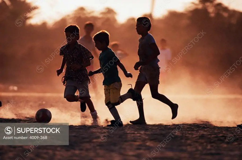 Boys playing soccer on the beach, Cabo San Lucas, Mexico