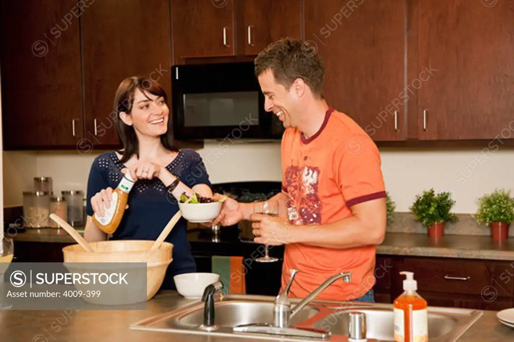 Couple preparing dinner in a kitchen