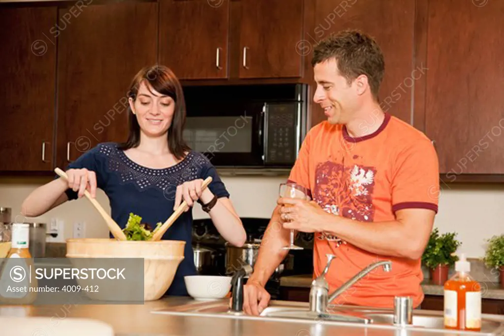 Couple preparing dinner in a kitchen