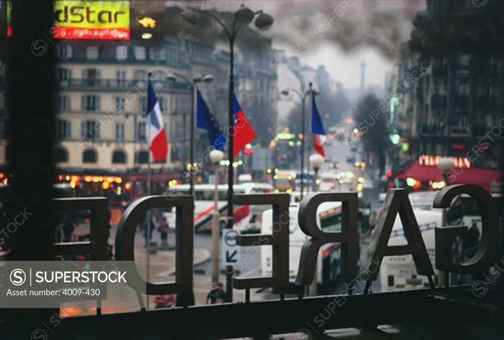 City street viewed through the window of Gare de l'Est railway station, Paris, Ile-de-France, France