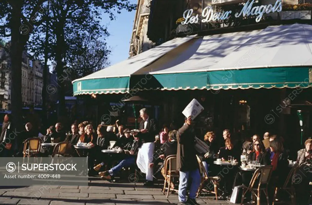 People at outdoor cafe, Les Deux Magots, Paris, Ile-de-France, France