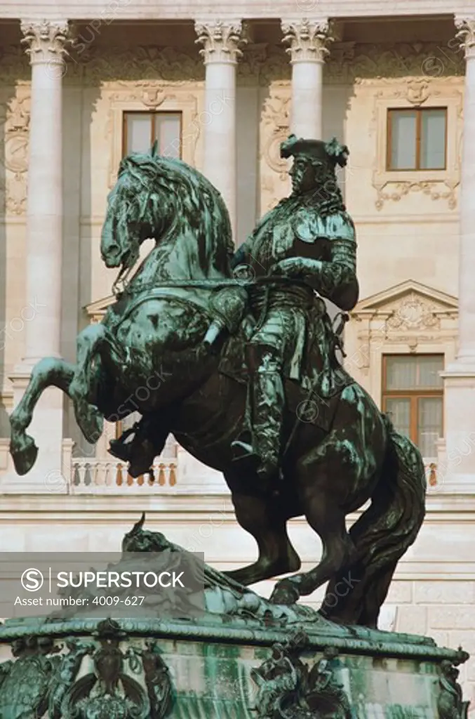 Statue of Prince Eugene of Savoy in front of a palace, The Hofburg Complex, Heldenplatz, Vienna, Austria