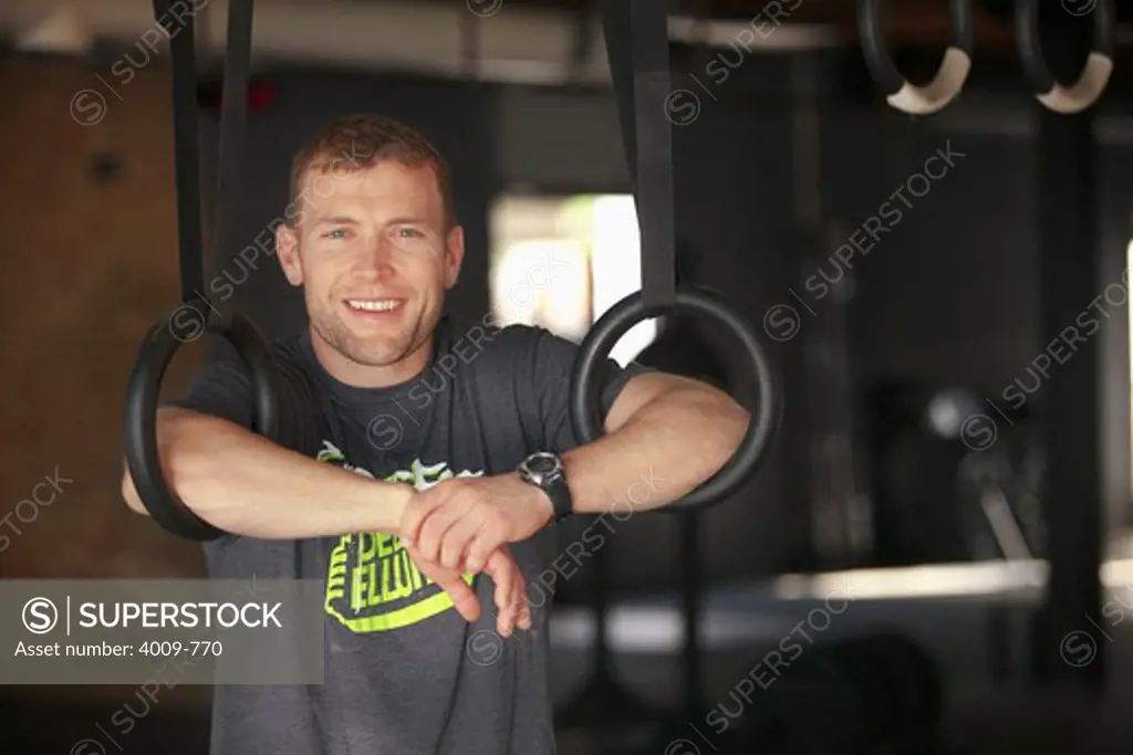 Portrait of man smiling in a gym