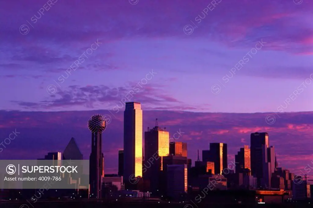 Downtown city skyline against a purple sky at sunset, Dallas, Texas, USA