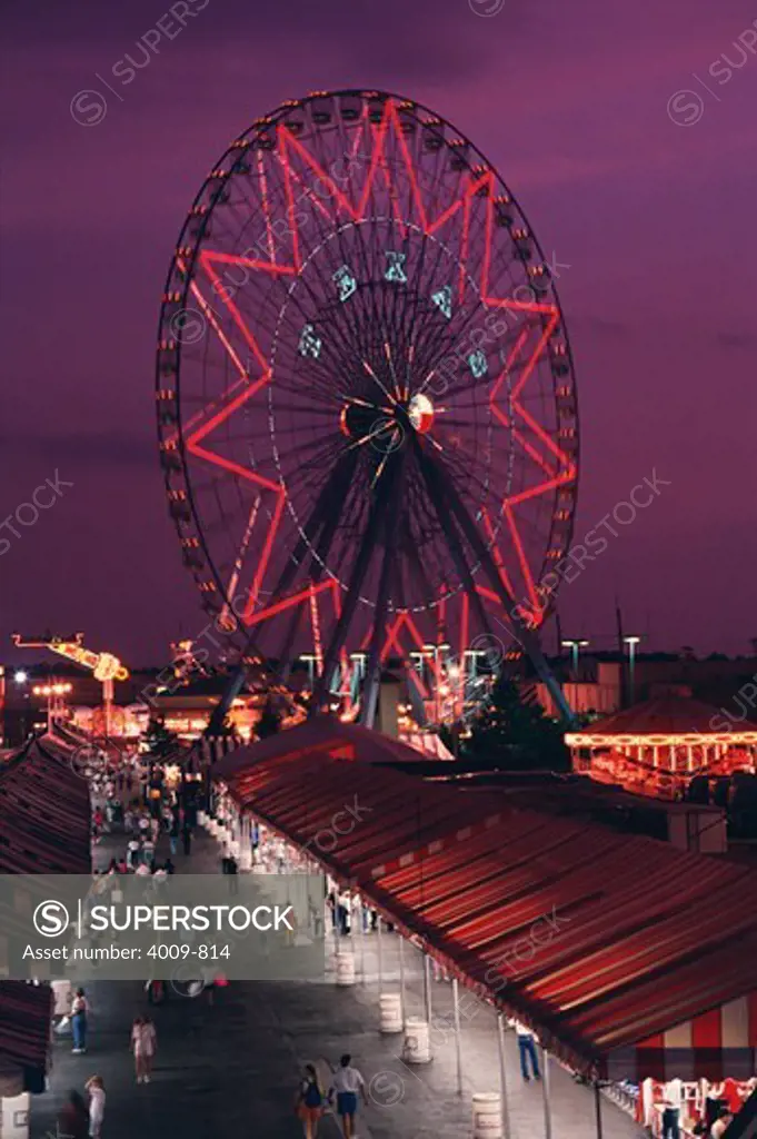 Ferris Wheel and the midway at the Texas State Fair at night, Dallas, Texas, USA