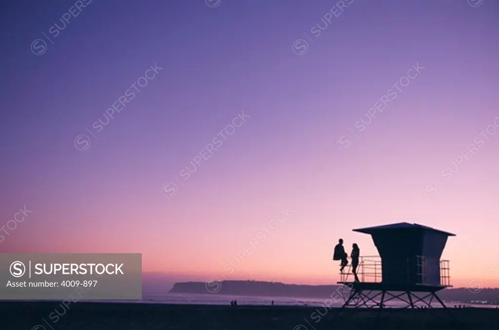 Couple on lifeguard tower at Coronado Beach, San Diego, San Diego County, California, USA