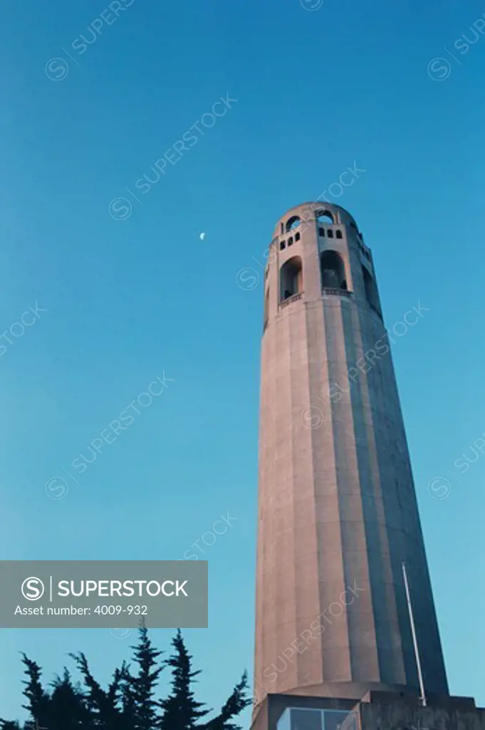 Low angle view of Coit Memorial Tower against a blue sky, San Francisco, California, USA