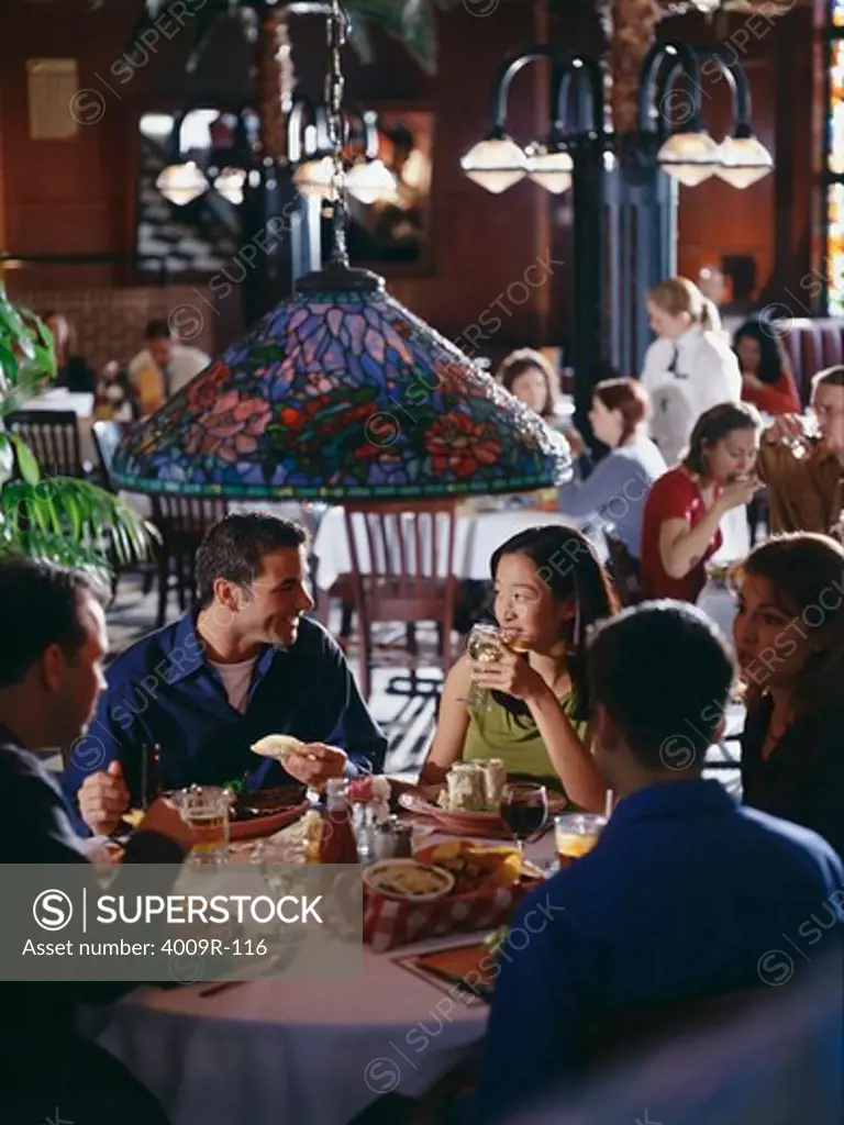 Group of friends having dinner in a restaurant