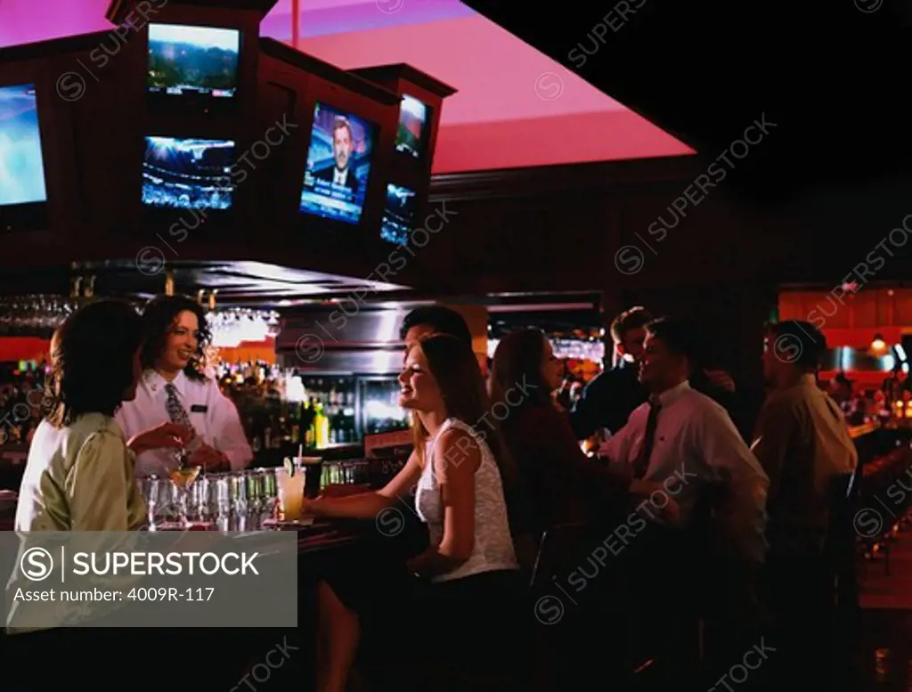 Group of people enjoying drinks in a bar