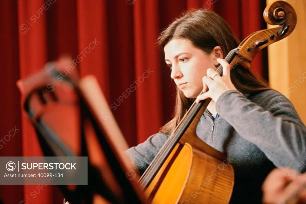 Young woman playing a cello
