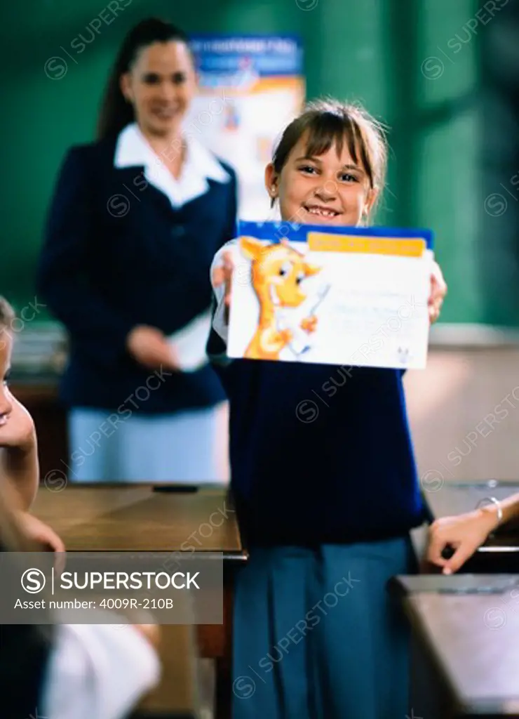 Schoolgirl showing her award