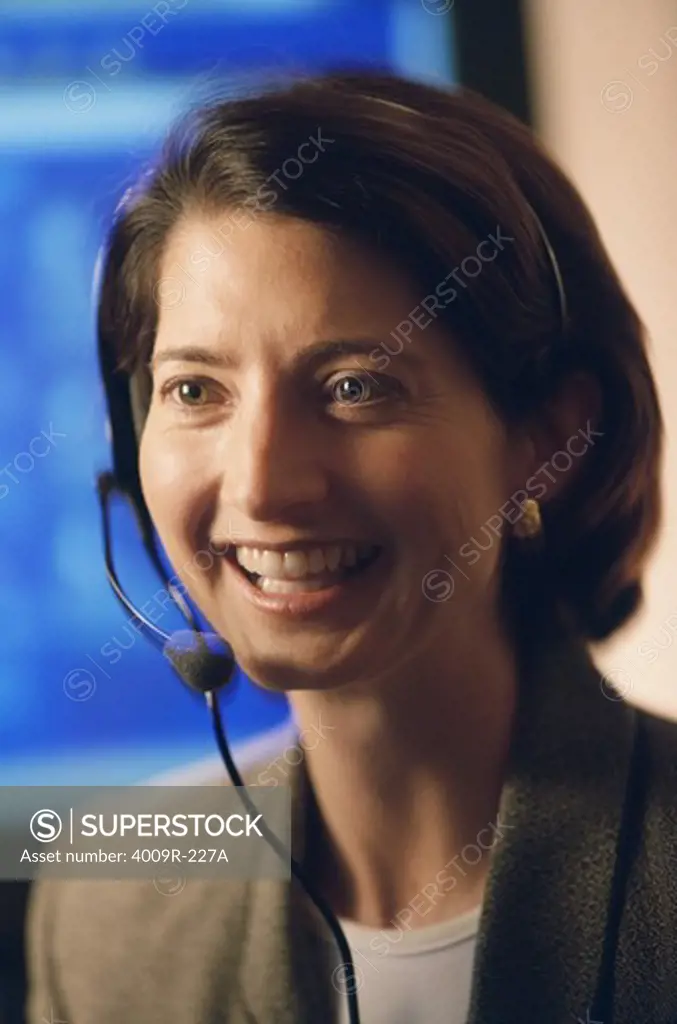 Close-up of a female customer service representative smiling