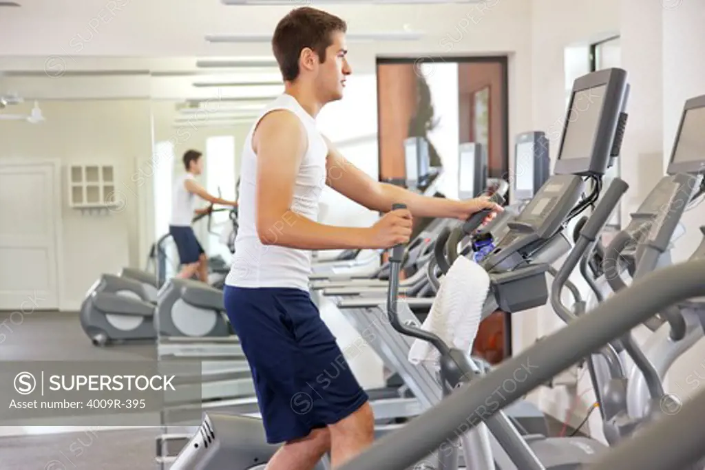 Young man working out at gym