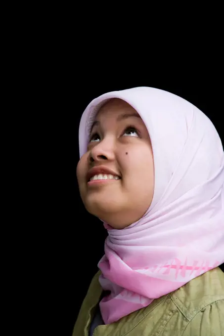 Indonesian teenager wearing headscarf smiling