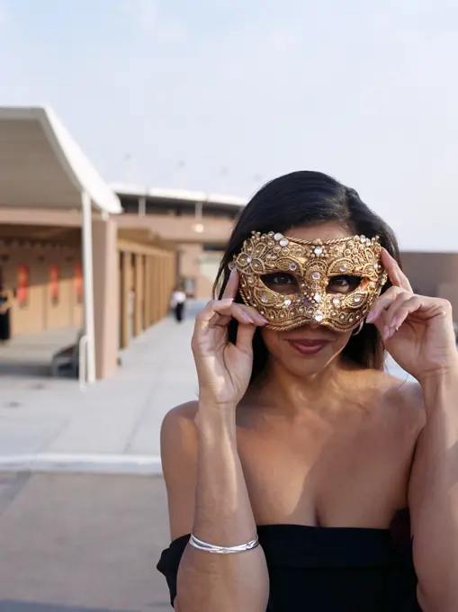 Hispanic woman wearing mask