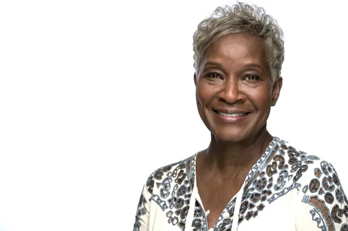 Portrait of older black woman looking at camera with smile