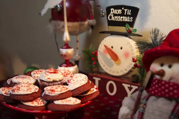 Detail of  dining room table decorated for festive Christmas party with cookies and decorations