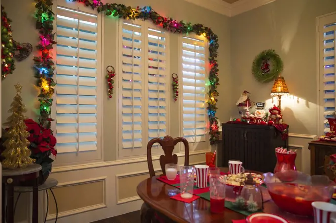 Dining room decorated for festive Christmas party with cookies and decorations