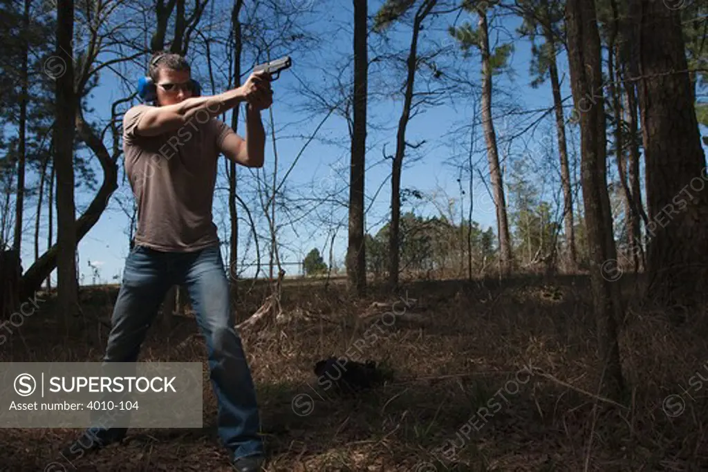 Man practicing target shooting