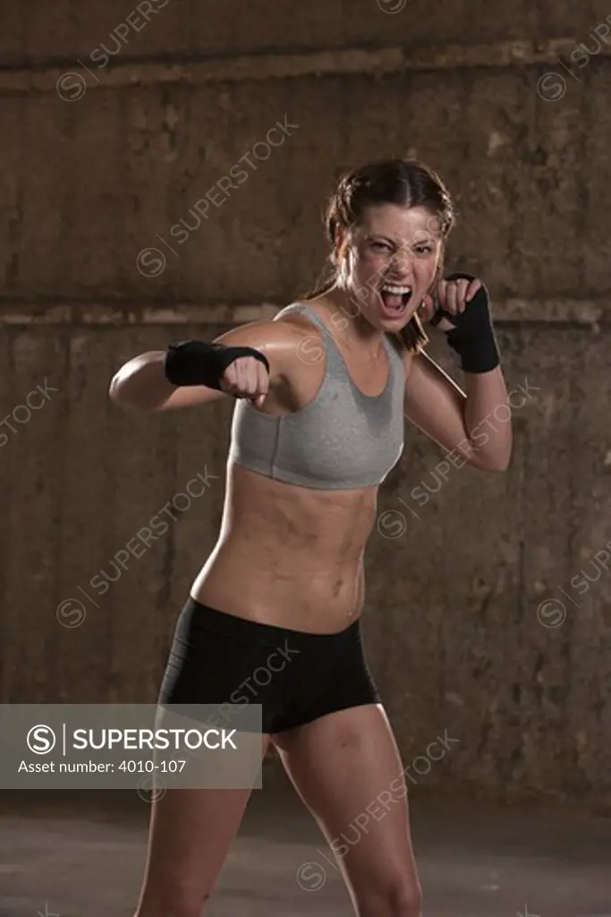 Portrait of a female boxer practicing