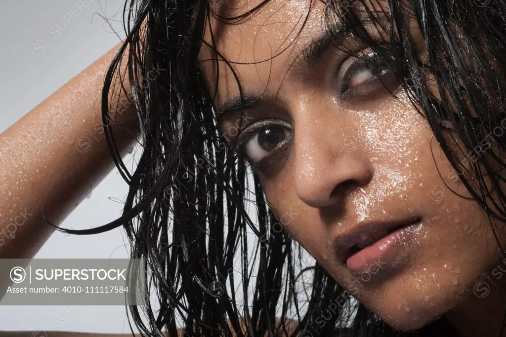 Sexy Indian woman with wet hair and face