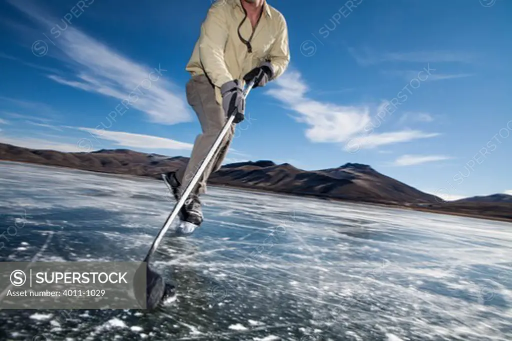 USA, Colorado, Ice skating at Blue Mesa Reservoir